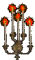 a lit candelabra attached to the wall